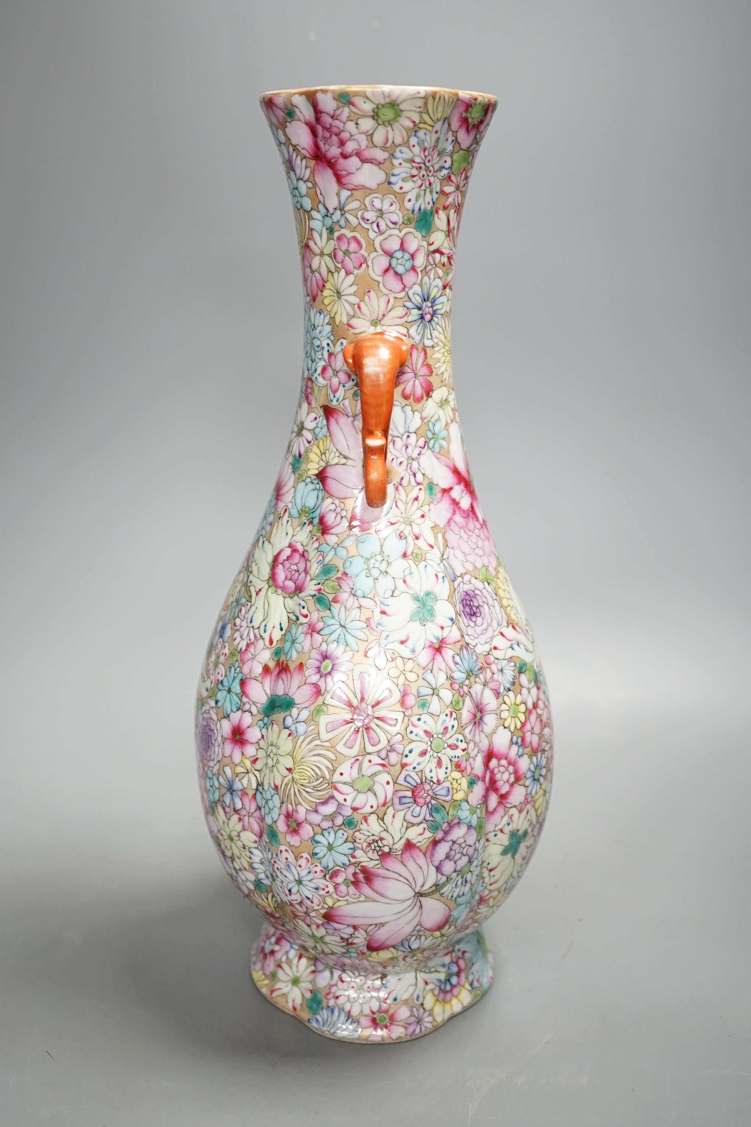 A Chinese famille rose millefleur 2 handled vase, 36cms high.